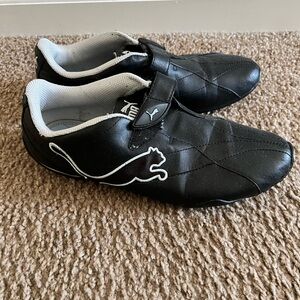 Puma women’s Black and White Sneakers